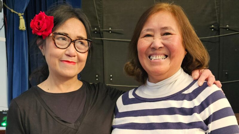 Dance teacher and particpant smiling portrait from Merton Fusion multicultural group event funded by South West London Winter Engagement Fund